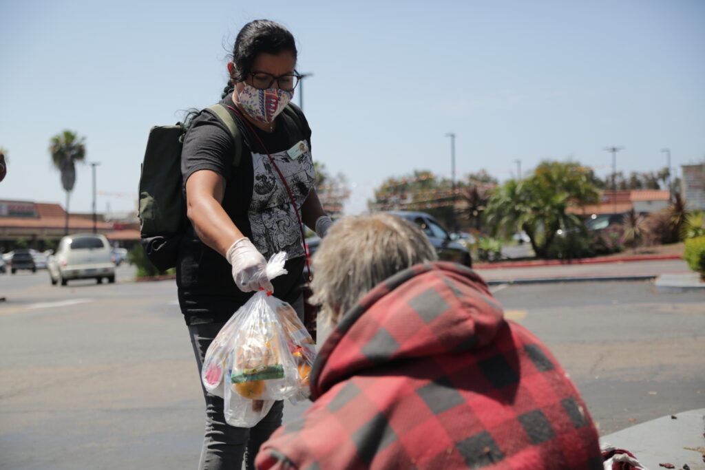 woman-distributing-food-and-water