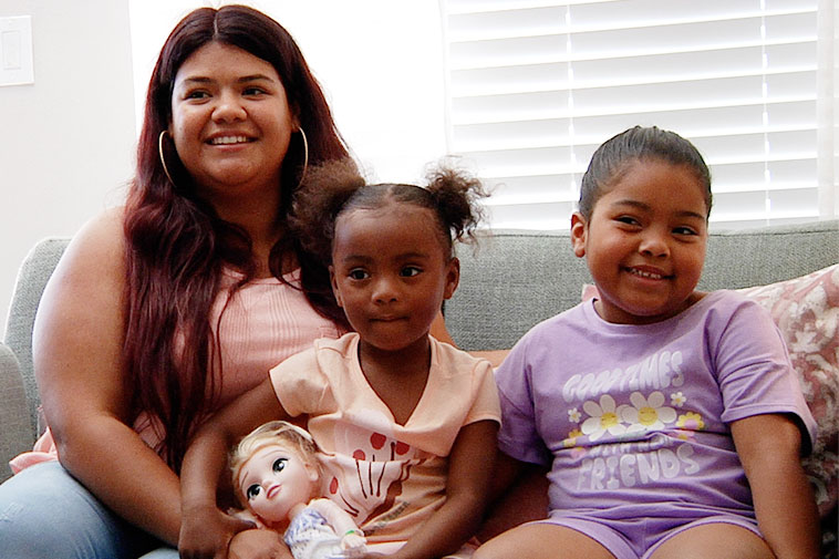 mother with two child and a child took a doll in hand, Lucky Duck Foundation